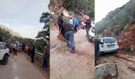 Yola düşen kayaları iple araca bağlayıp çektiler