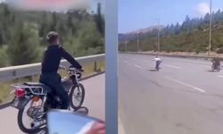 Otobanda motorun üzerine uzanarak ölüme yarış pahalıya patladı