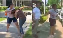Kocasıyla birlikte parkta bastığı kadını saçından sürükledi