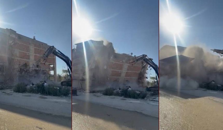 İş makinası, üzerine doğru yıkılan 6 katlı binanın altında kalmaktan saniyelerle kurtuldu